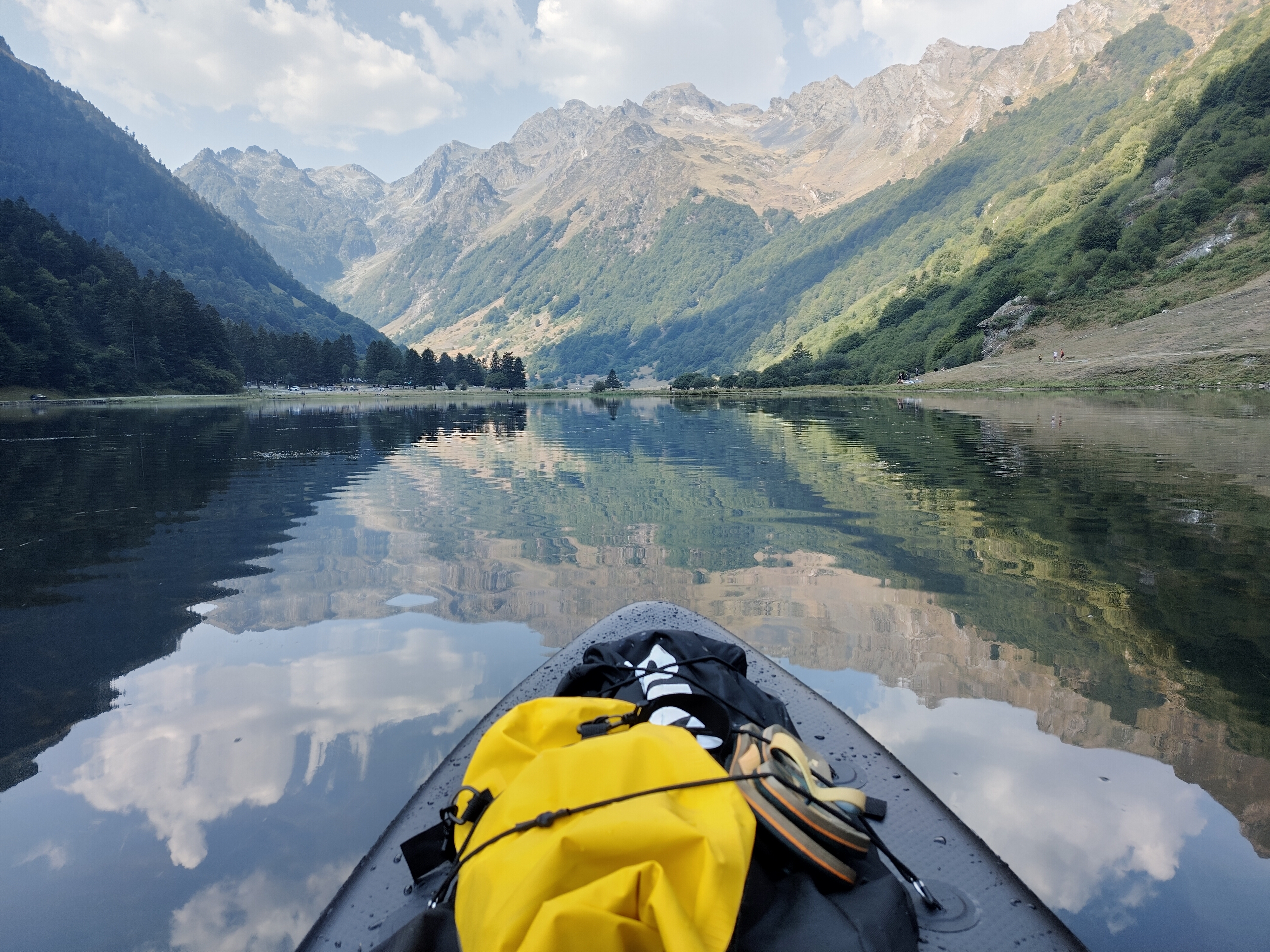 view of a mountain lake, taken from a SUP board